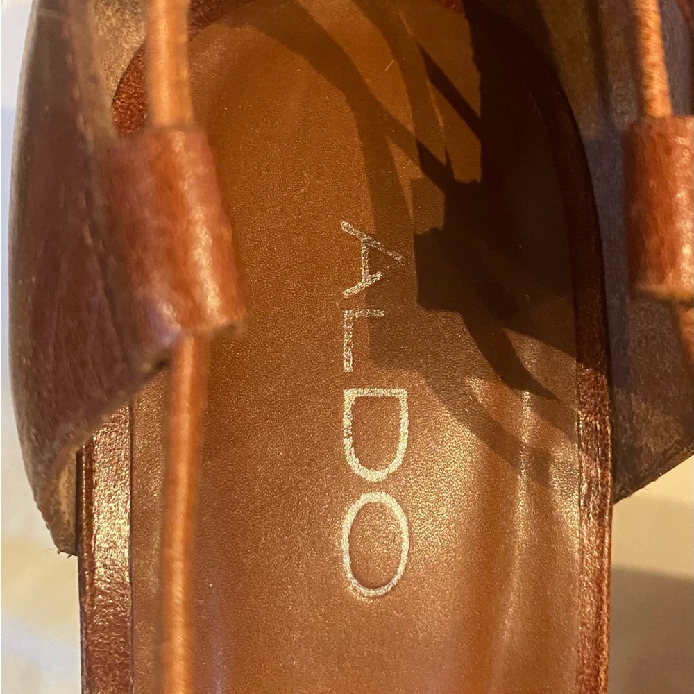 Aldo platform shoe with leather tie-ups on calf. Leather tone gently used